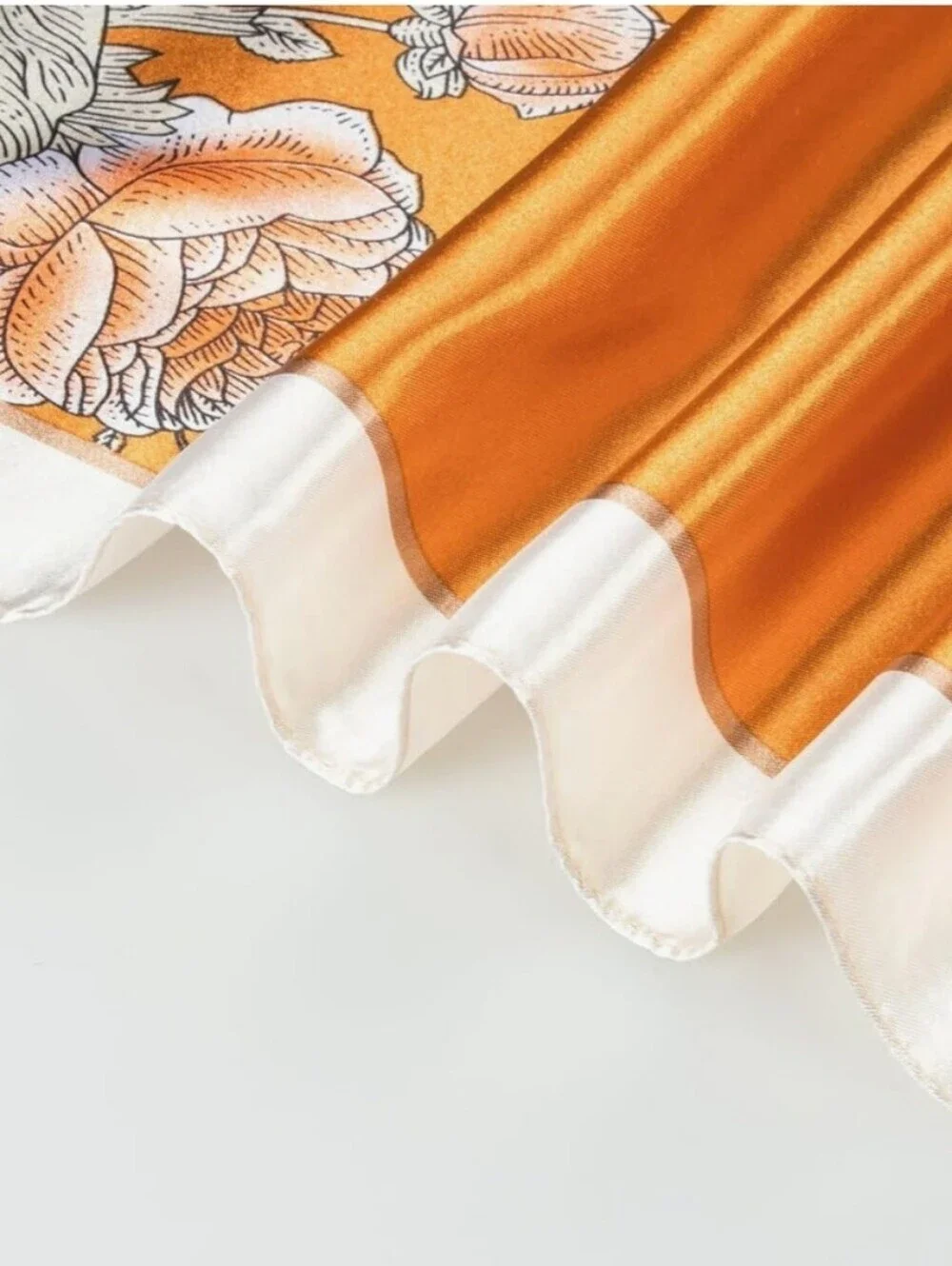 Womens Silk-Like Satin Scarf Features A Diagonal Orange And Cream Floral Pattern